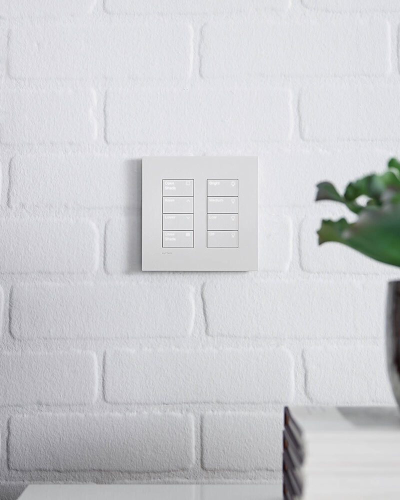 Two Lutron Palladiom Keypads. One controls lighting, and the other controls automated shading.